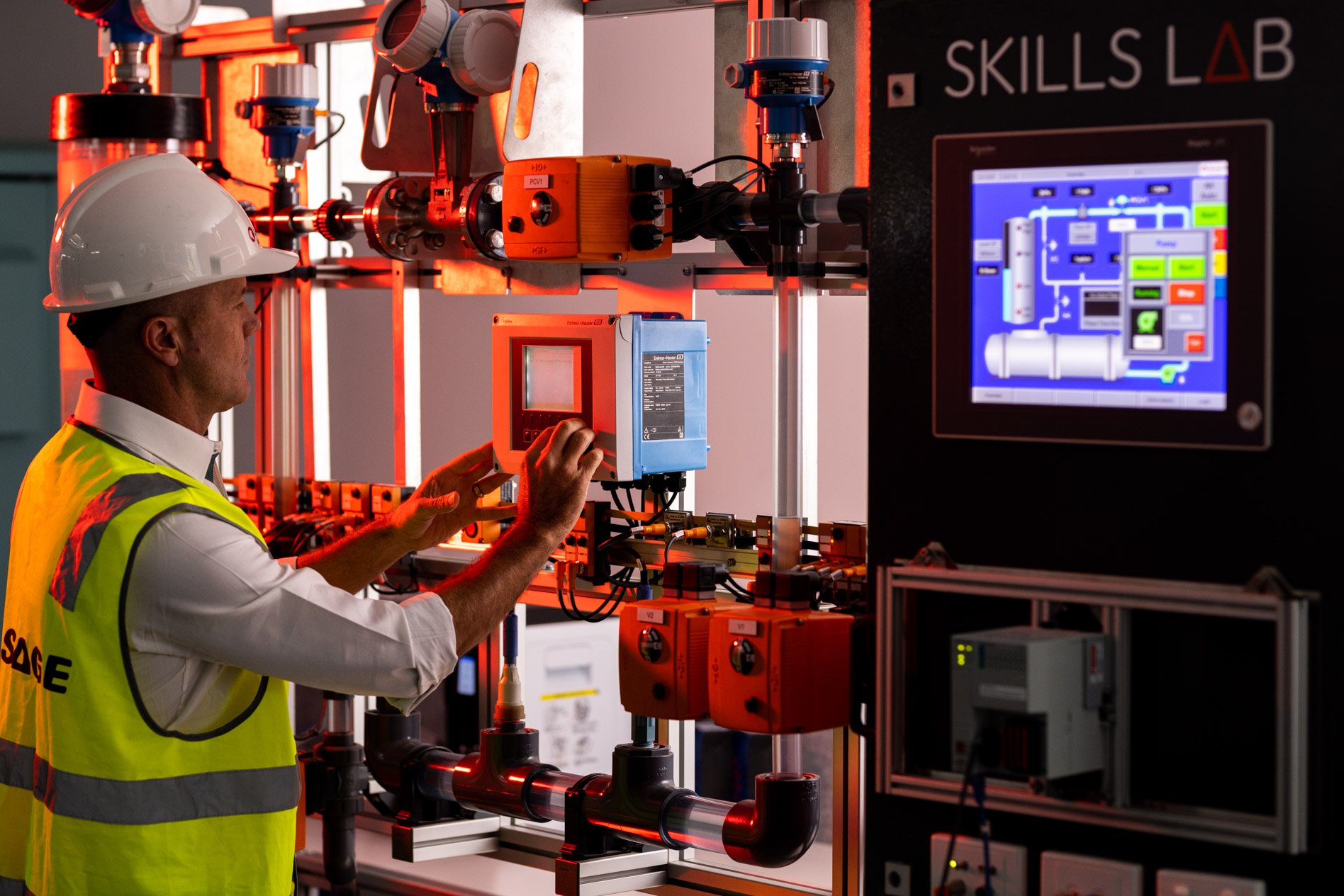 Man in hi-vis using a technical machine rig.